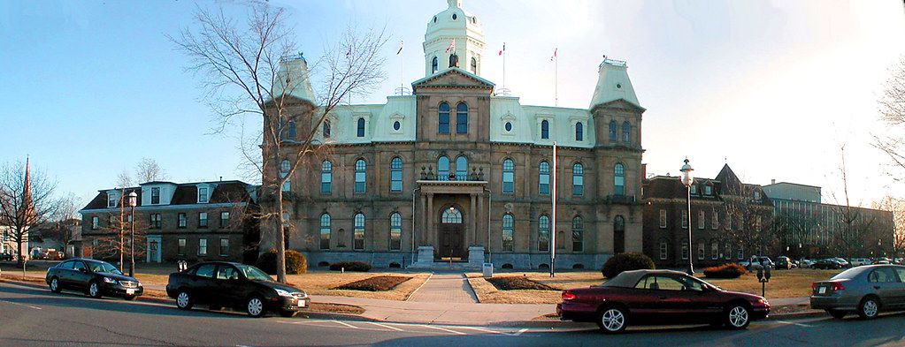 The New Brunswick Legislative Building with cars parked out front